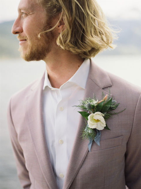 Montana groom with boutonniere in white and blue