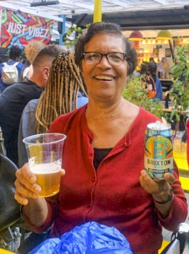 woman enjoying a Brixton brew