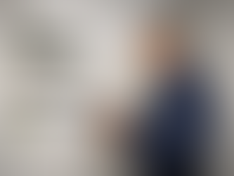 PK Group electrician carrying out an EICR electrical inspection on a commercial consumer unit in Chesterfield