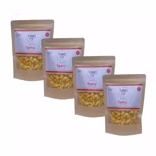 Four Yummee Pop Spicy popcorn bags in a row.