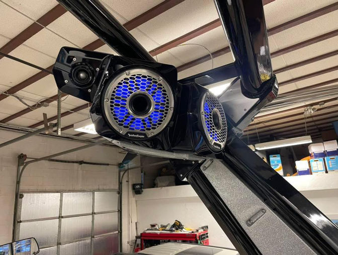 Close-up of marine-grade wakeboard tower speakers installed on a speedboat