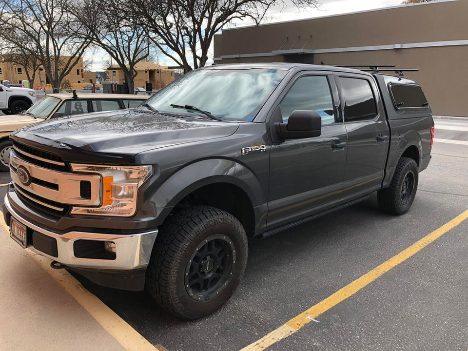 4-door vehicle with tinted windows, highlighting privacy and sun protection.