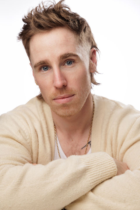 Man with light skin and blonde hair in a studio setting. Nick Johnson Photo