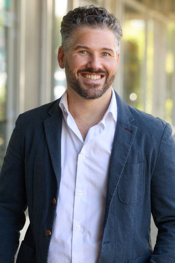 Smiling man wearing a blazer, EDITORIAL PORTRAITS, business professional portrait, Nick Johnson Photo