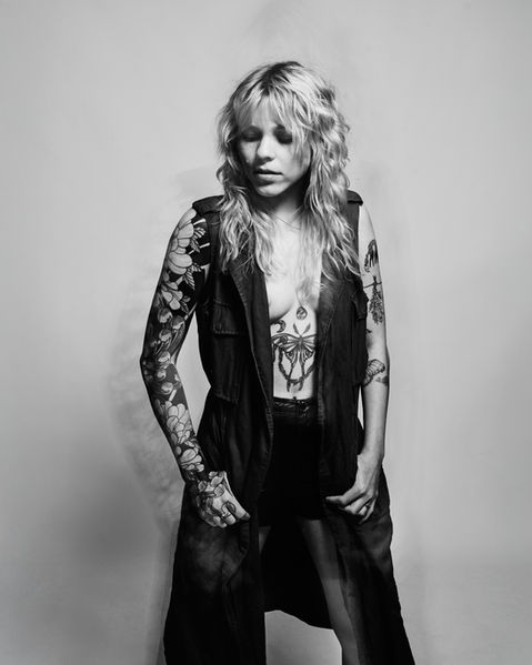 Black and white portrait of tattooed woman