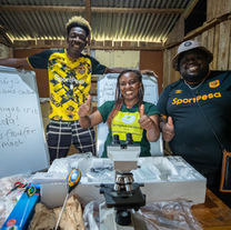 Patricia Henry together with the Tujiamini team during the unveiling of the Gold Community Award.