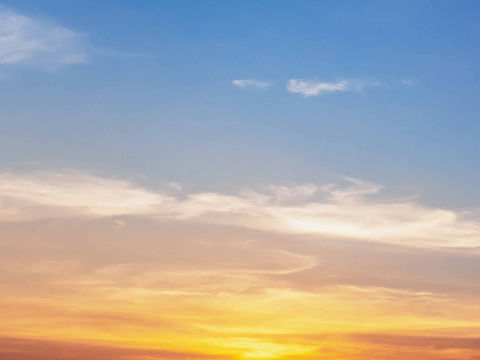 Why is the sky blue above but reddish around a sunset?