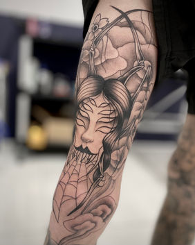 A black and grey Jorogumo tattoo depicting the spider/lady yoke. With cloudy Neo-japanese background