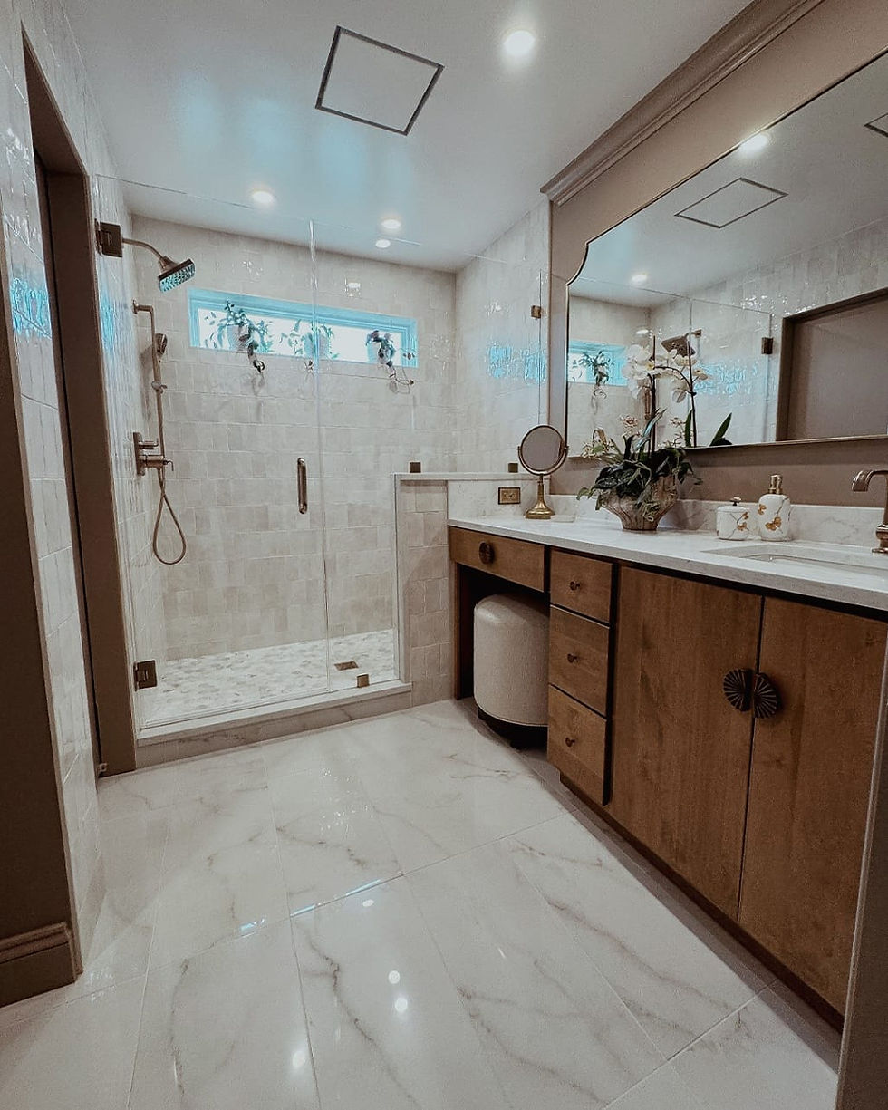 Modern spa-style shower featuring elegant tiling and a quartz bench, representing a luxurious and functional outcome of a high-end Bathroom Remodel Virginia.