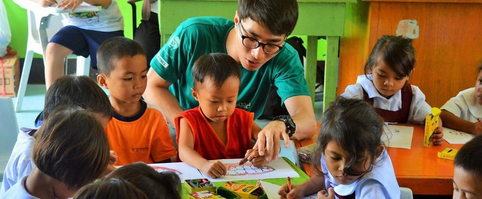 Techer teaching poor children.jpeg