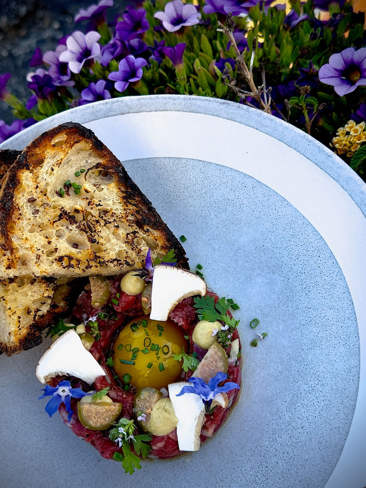Toast with burrata and garden flowers