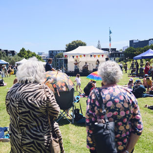 Older woman watching the band onstage