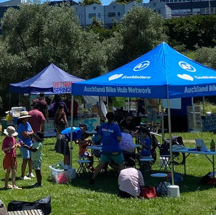 Eco Matters stall is shown with people doing craft activities