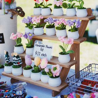 Cute little crocheted products from Charlotte and Co are nicely displayed on their market stall