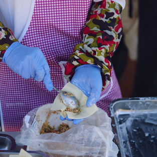 Vegan Cuisine chef making hand made wontons in the park