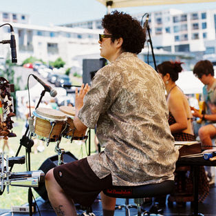 The drummer in Crystal Chens band playing their set on stage