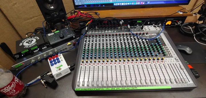 Mixer and recording equipment at the workstation.