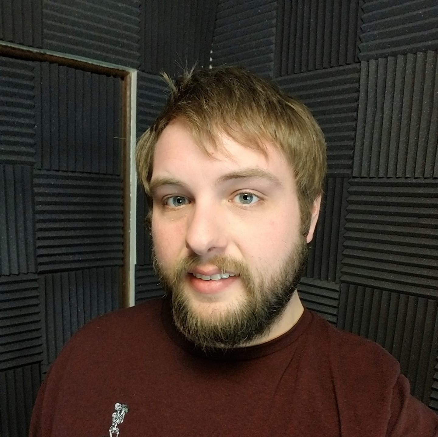 Eric Bodreau in a recording space with acoustic treatment