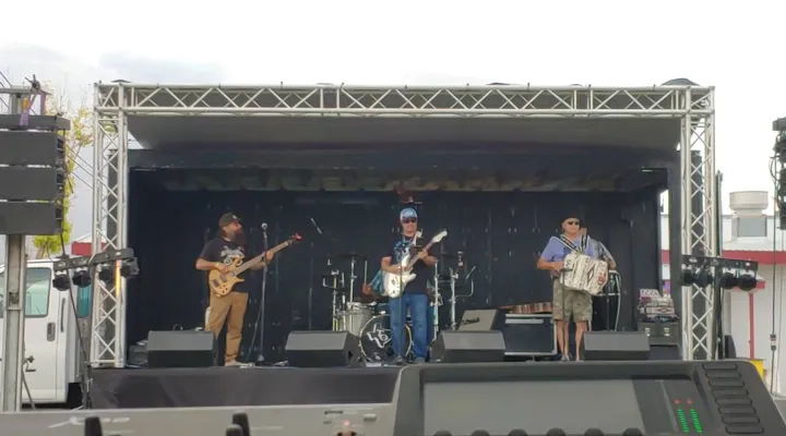 A band performing on an outdoor stage.