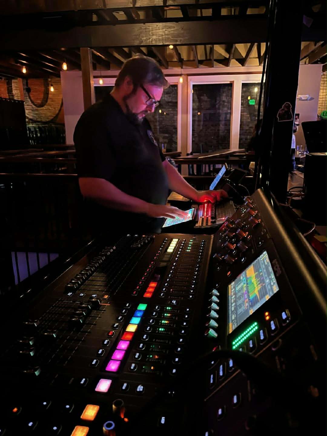 Eric Bodreau mixing live sound at The Olympic