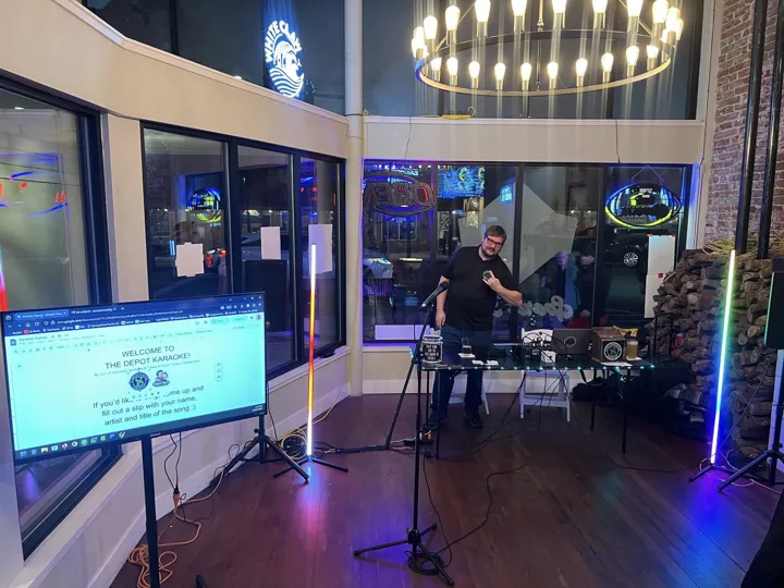 The karaoke station, microphones and song display.