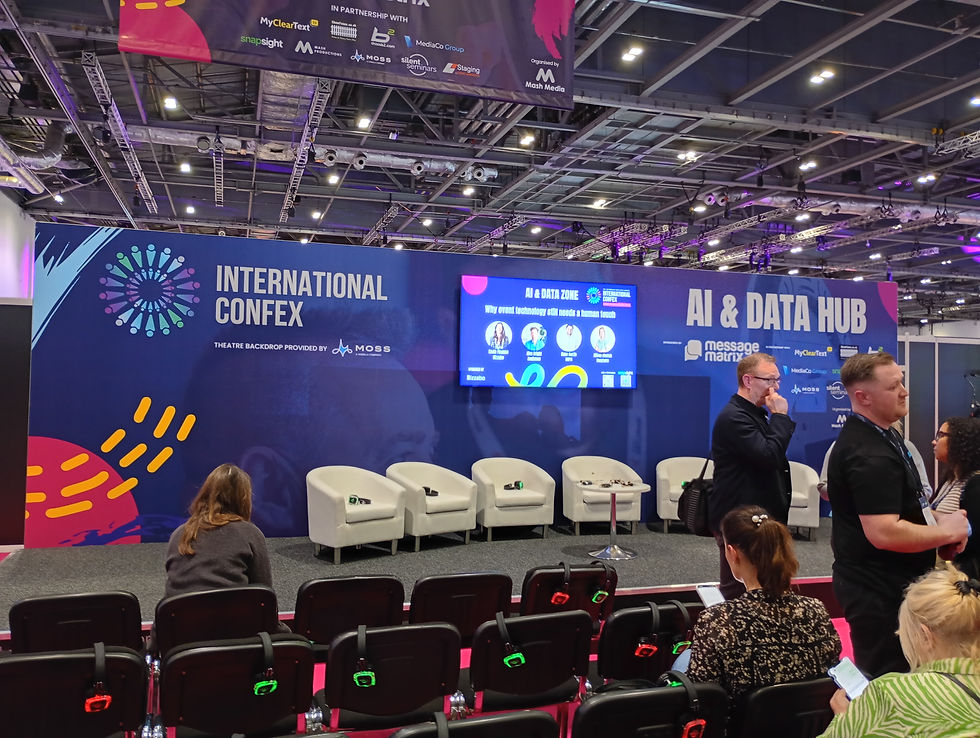 Attendees gather at the AI & Data Hub during the International Confex, ready for discussions on integrating human touch with event technology amidst vibrant conference branding.