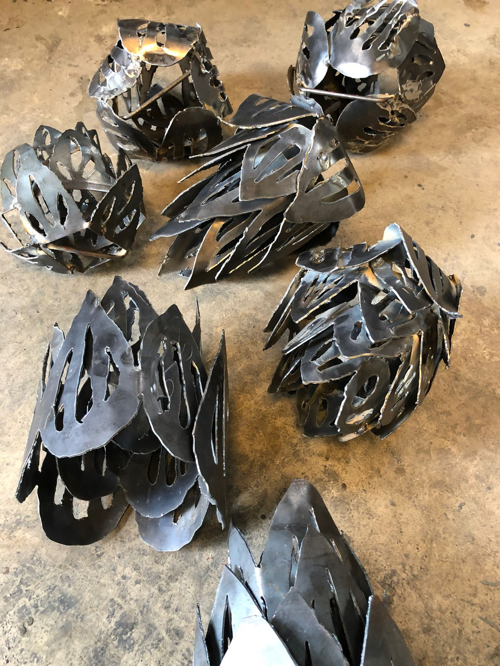 Steel fabrication and design of hops bud light fixture for brewery.