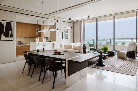 Modern living room with dining table, scenic views and Nu Projects Dubai.
