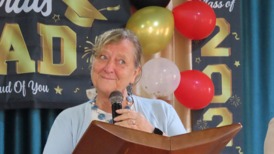 Colleen Stevenson, U4U Church of God missionary, is pictured speaking at the Vocational School graduation in Uganda.