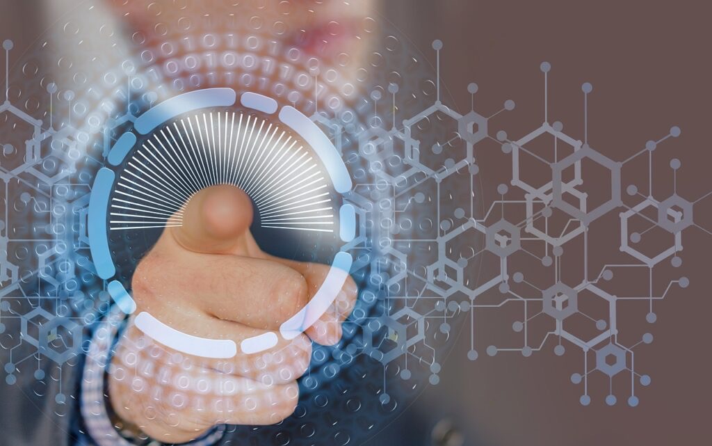 Hand holding glowing digital sphere with binary code and molecular structure patterns on brown background.