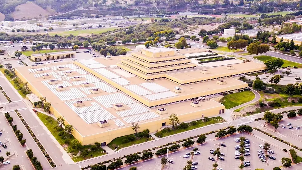 Aerial view of the Chet Holifield Federal Building in Laguna Niguel, a massive tiered government structure known as the Ziggurat, surrounded by parking lots and greenery.