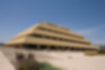 Front view of the Chet Holifield Federal Building in Laguna Niguel, also known as the Ziggurat, showcasing its distinctive tiered, pyramid-like architecture under a clear blue sky.