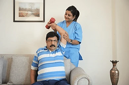 indian-physiotherapist-help-mature-man-260nw-2569400083.png