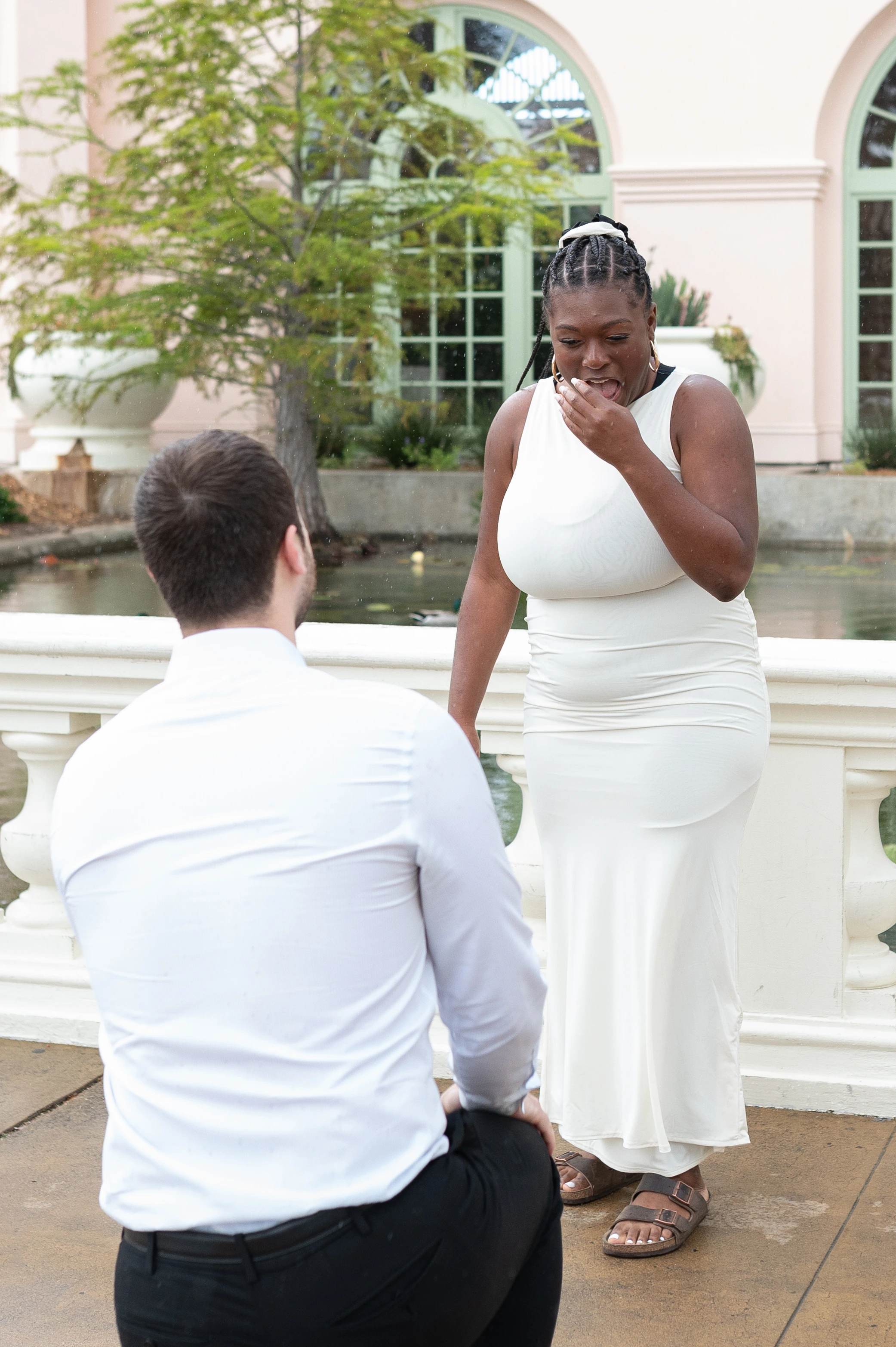 man kneeling proposal Balboa Park San Diego emotional moment