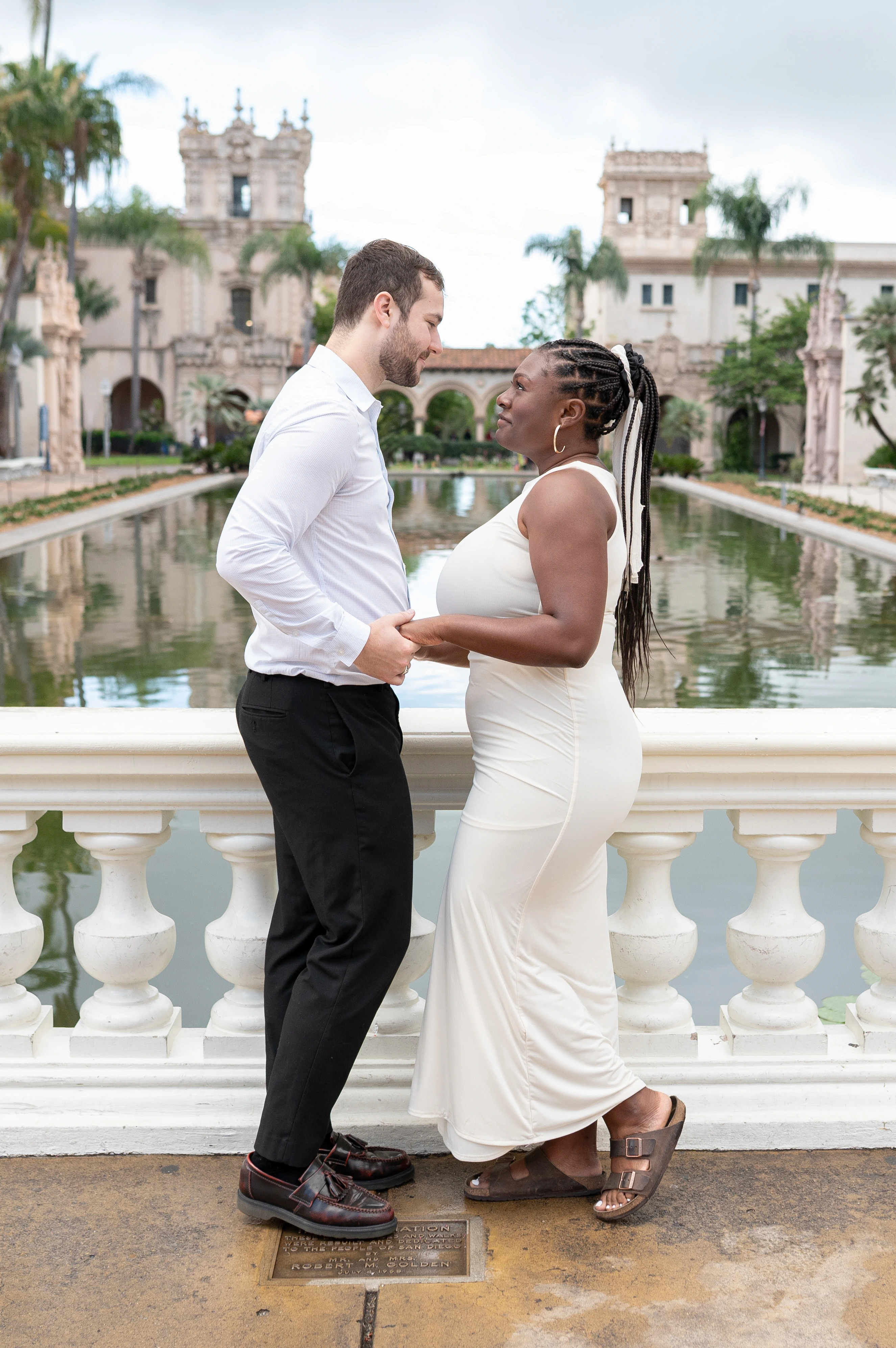 couple embracing close after proposal Balboa Park