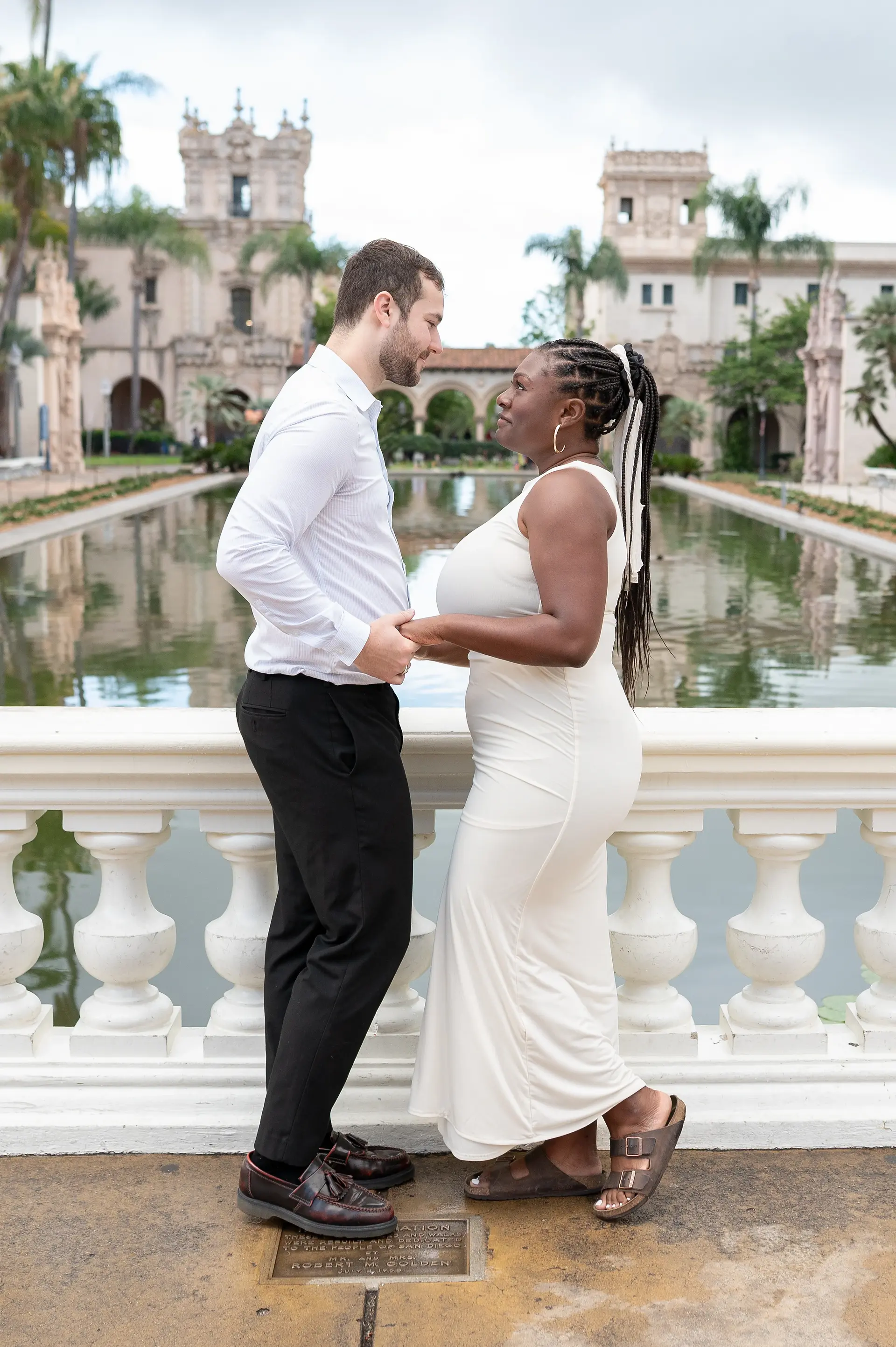 couple embracing close after proposal Balboa Park