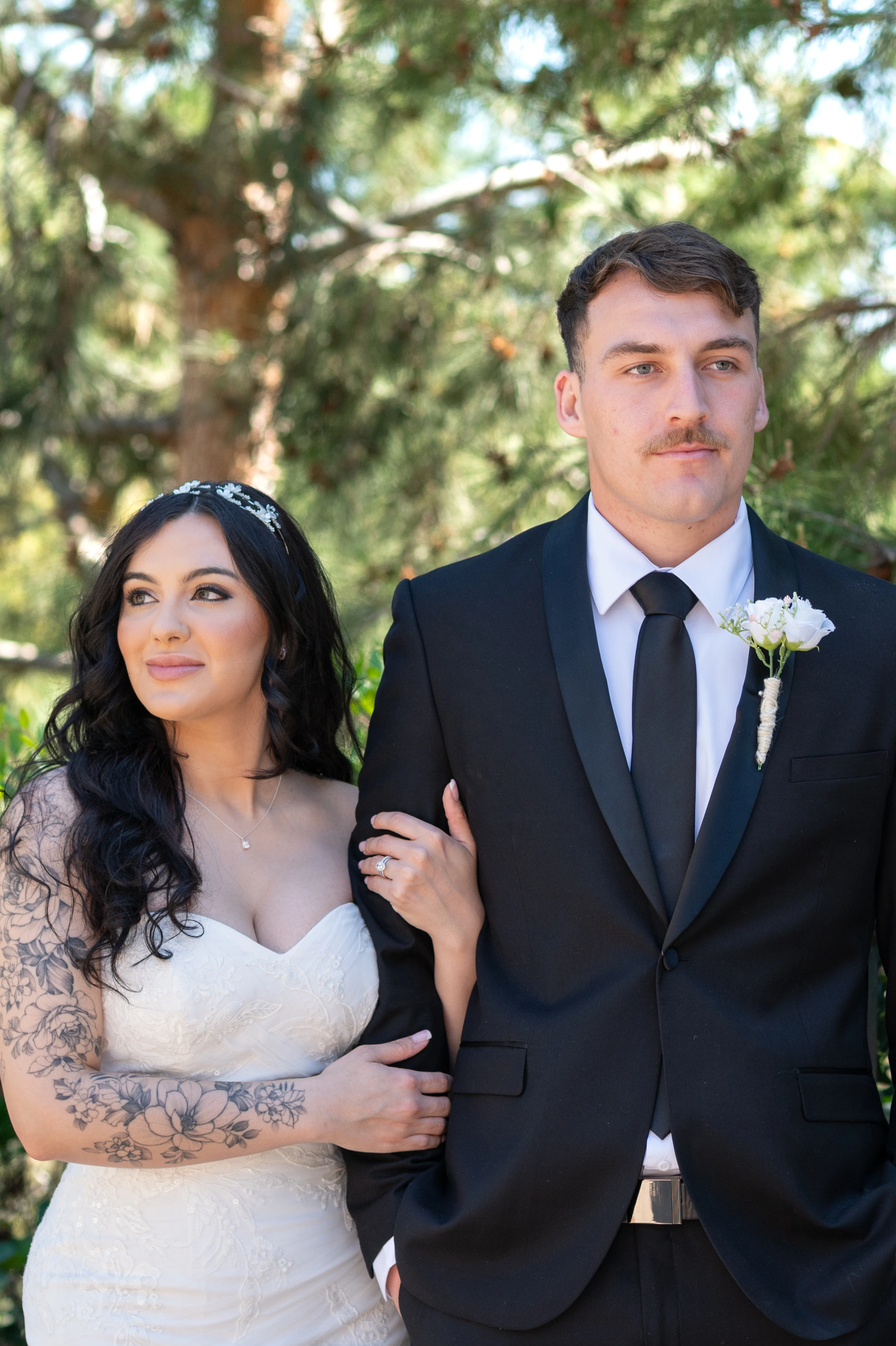 Couple standing shoulder to shoulder during their Balboa Park elopement in San Diego.