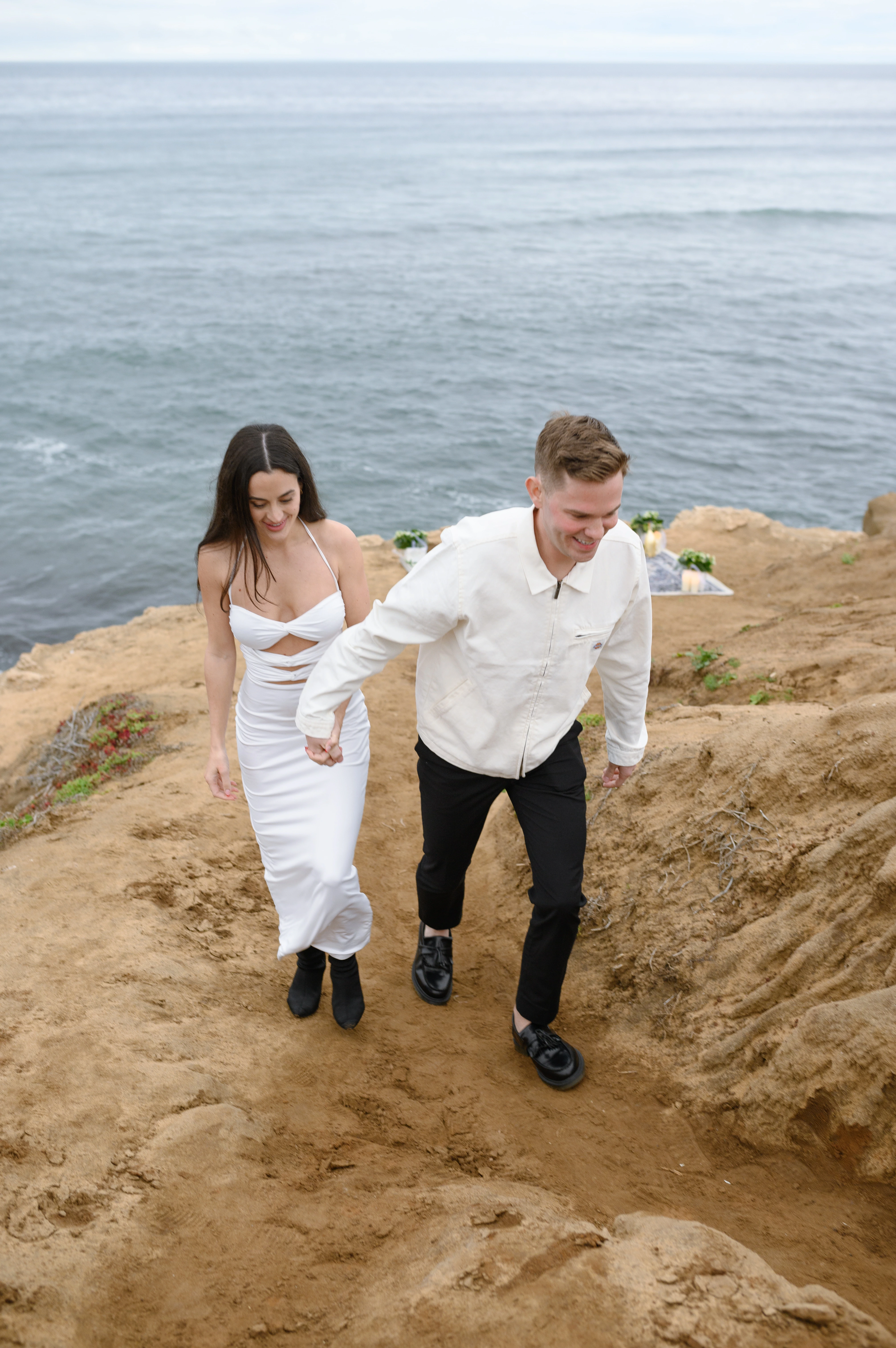 couple walking after proposal Sunset Cliffs San Diego