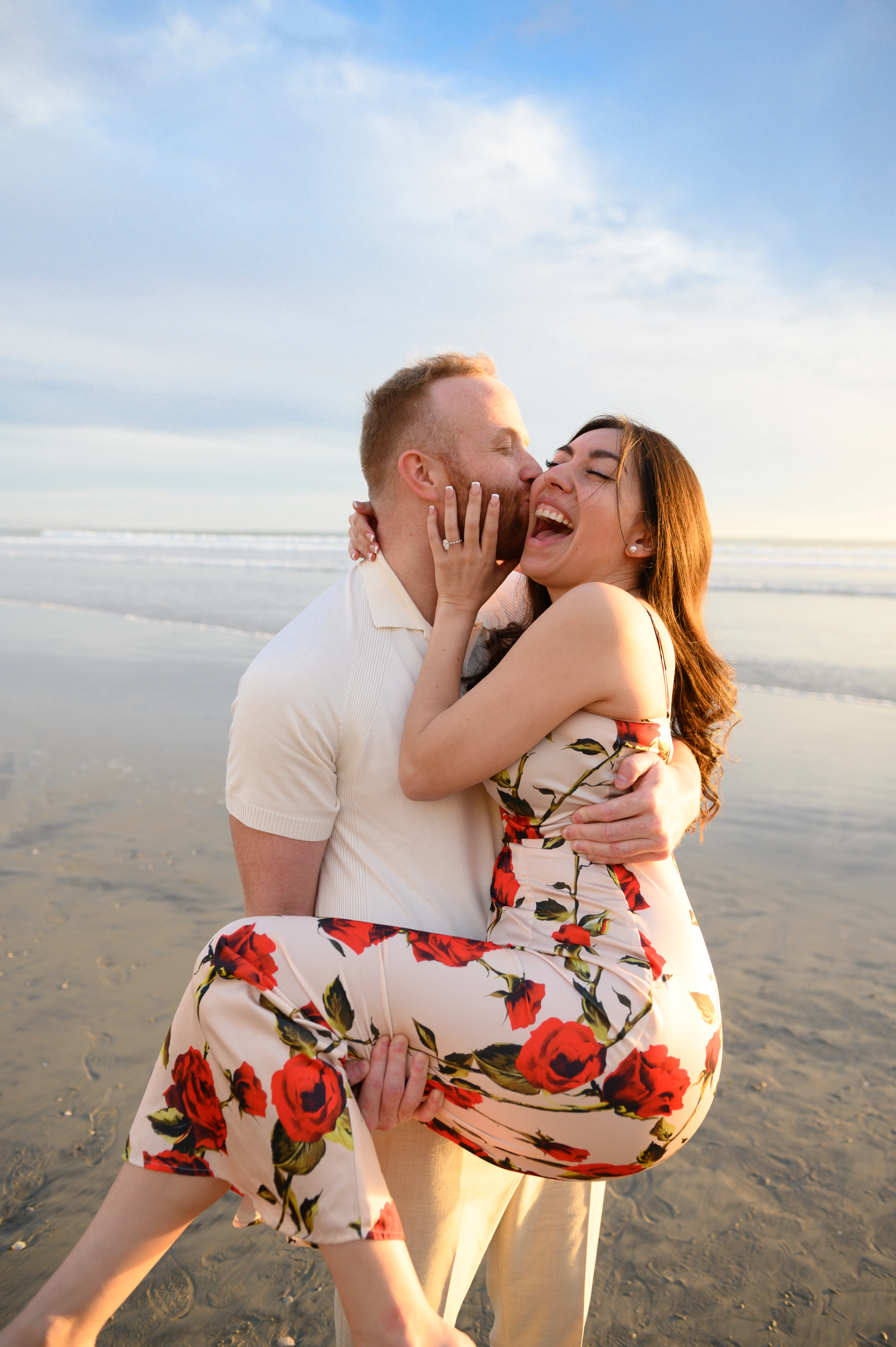 man lifting partner playful moment Coronado proposal