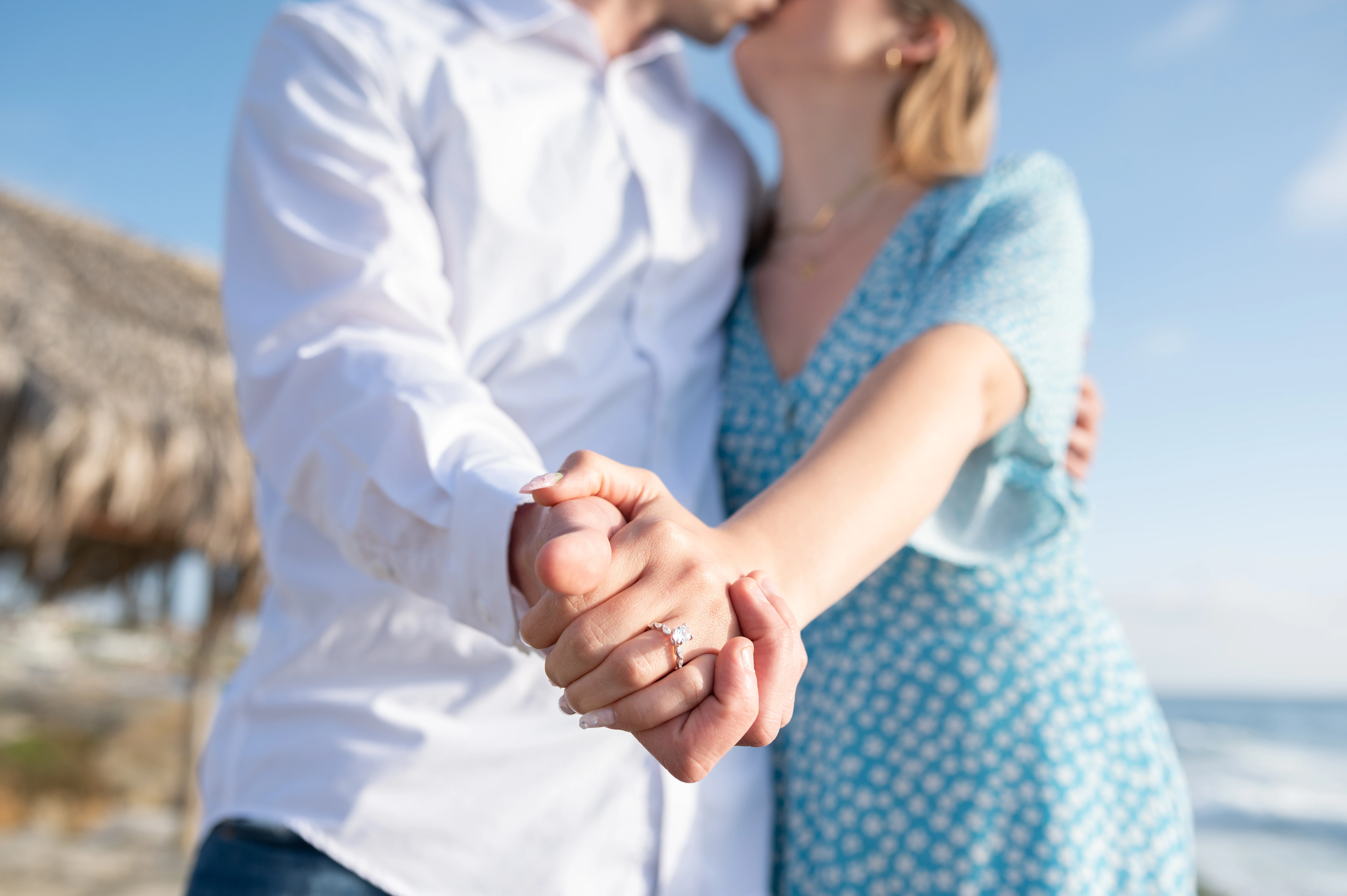 engagement ring close up at Windansea Beach with ocean background