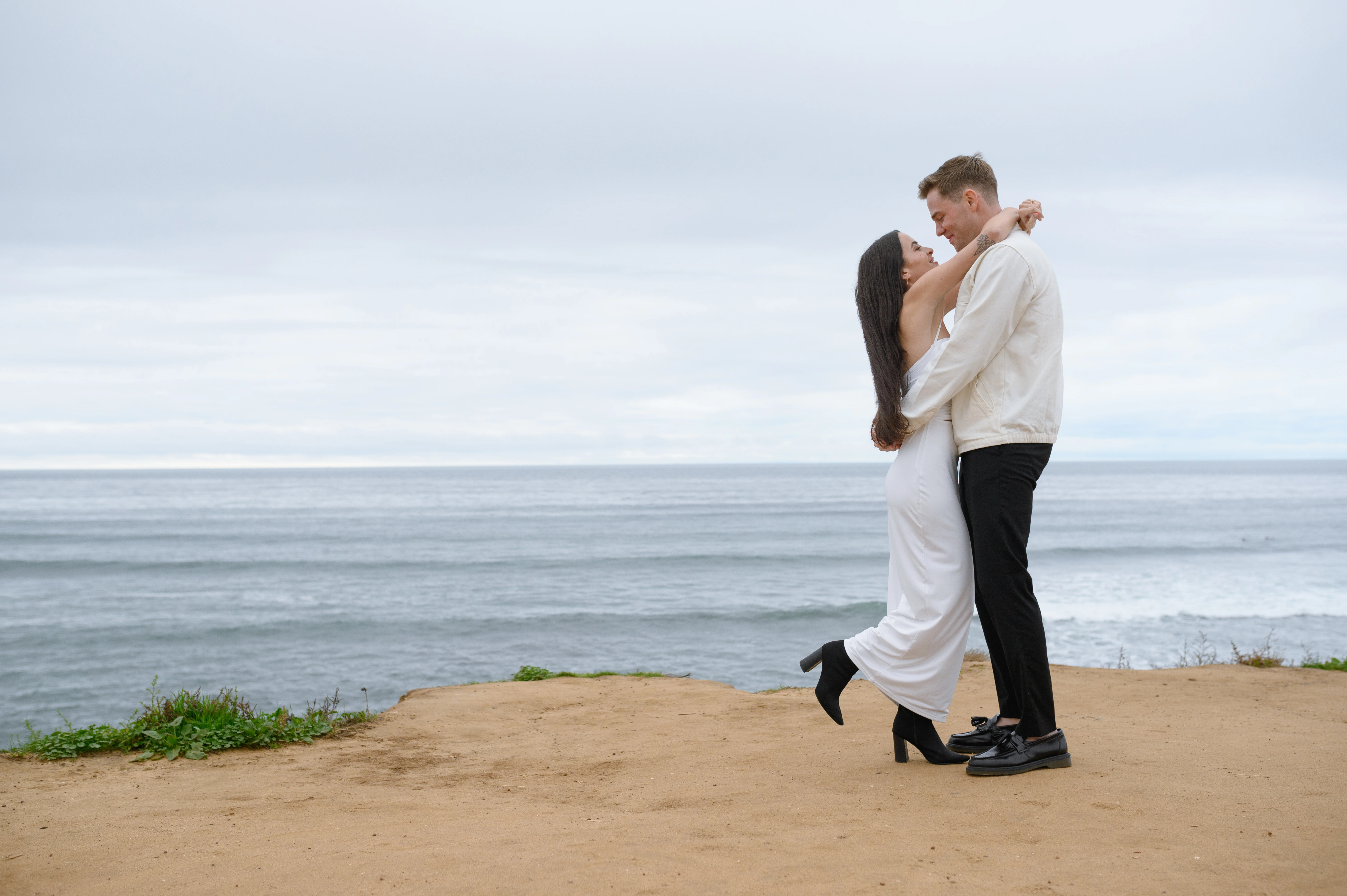couple laughing after proposal Sunset Cliffs