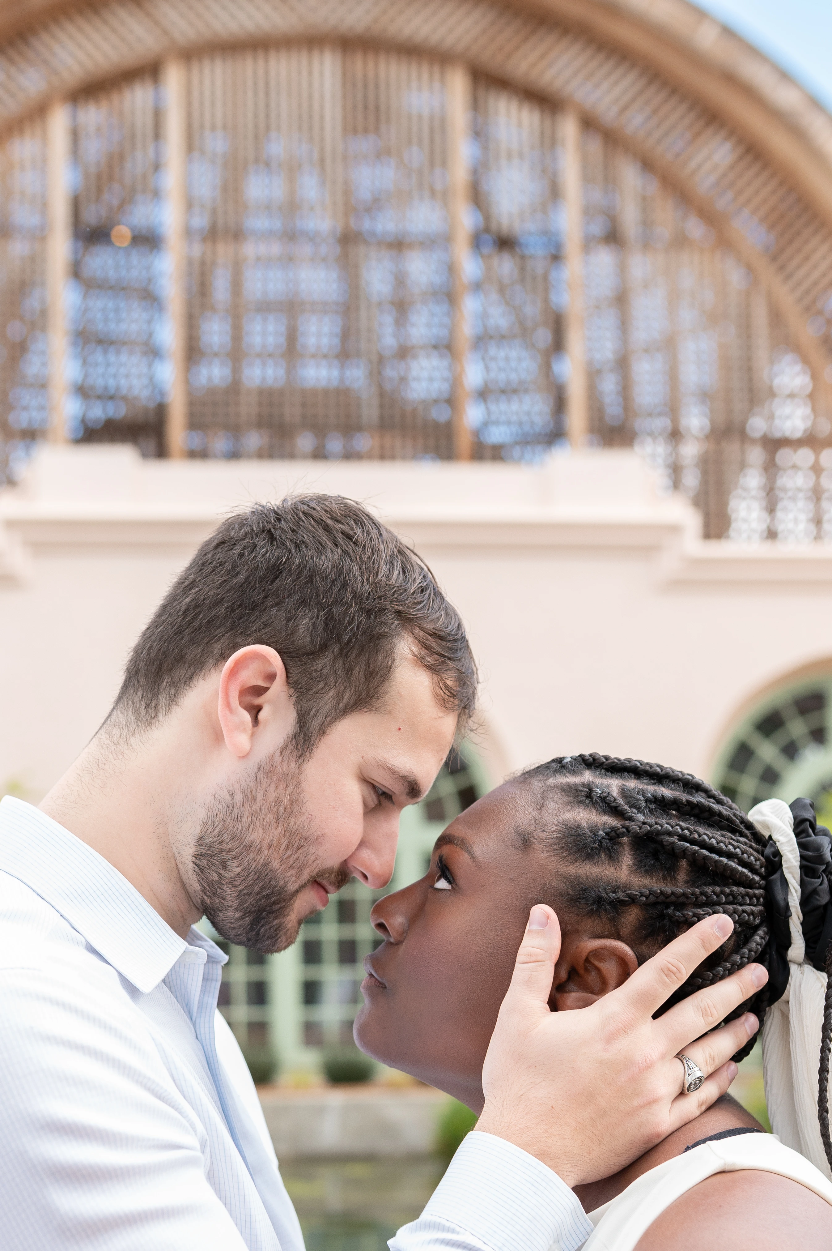 couple deep eye contact after proposal Balboa Park