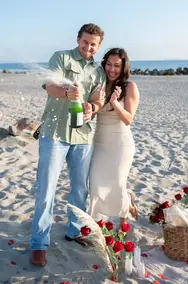 opening champagne after proposal Coronado Beach