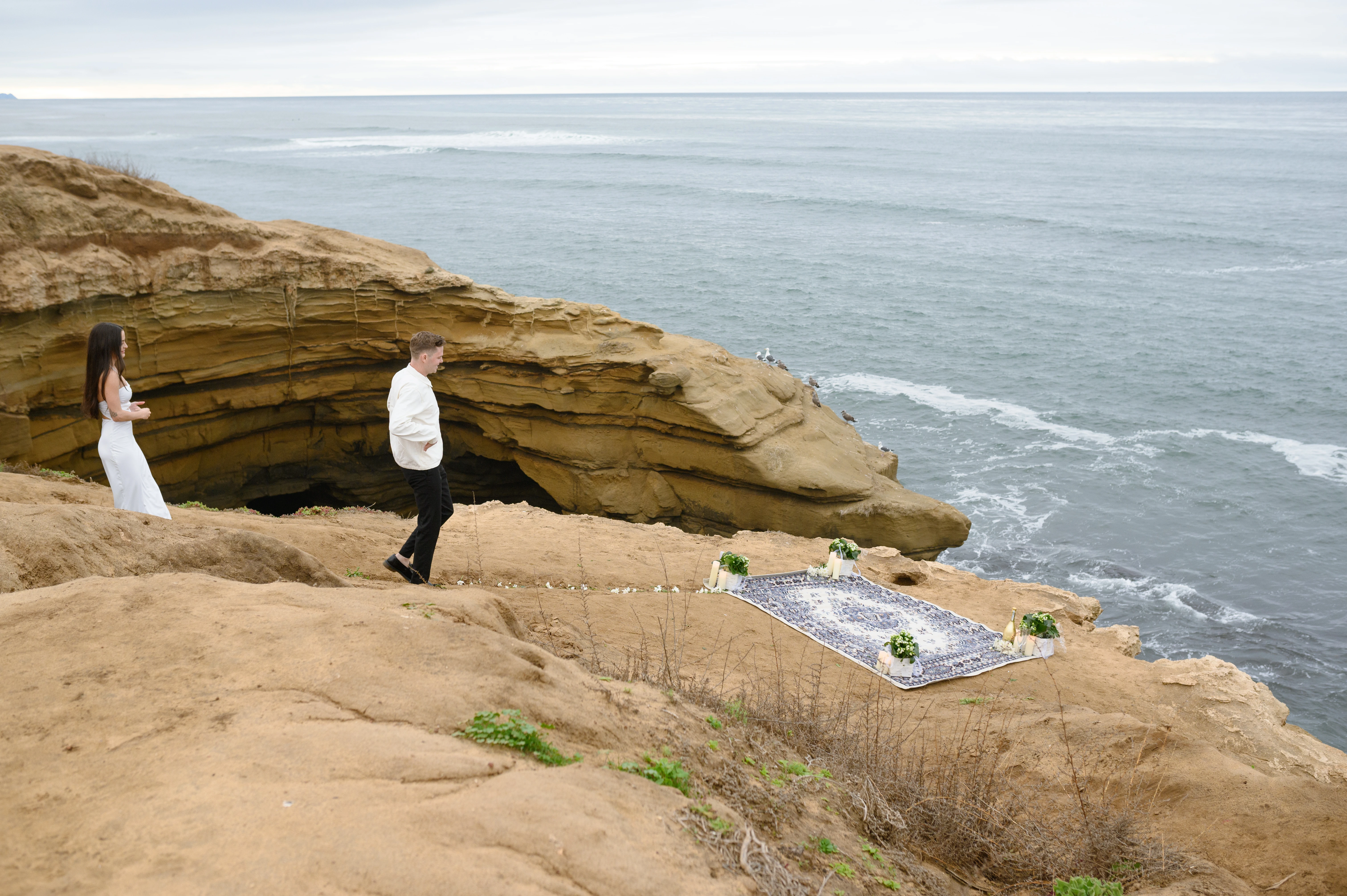 couple walking before proposal Sunset Cliffs San Diego