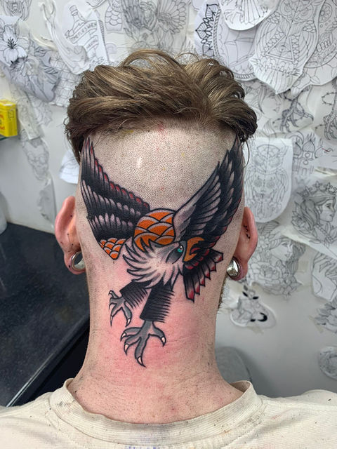Old School trad eagle tattoo on the back of a head by Will at Paradise tattoo High Wycombe 