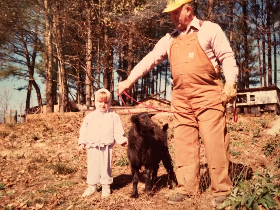 Young Brooke Snider on the farm with a family member and a pony