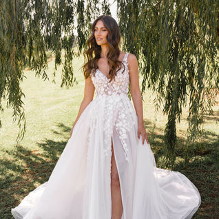 A line wedding dress, floral motives, v neck bodice with sequin and beading. Madi lane.