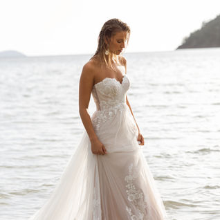 A line, ivory wedding dress. Strapless sweetheart. Madi lane.