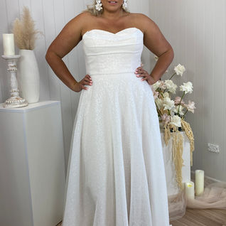 Madi lane wedding dress. A line. Full skirt, bodice strapless.