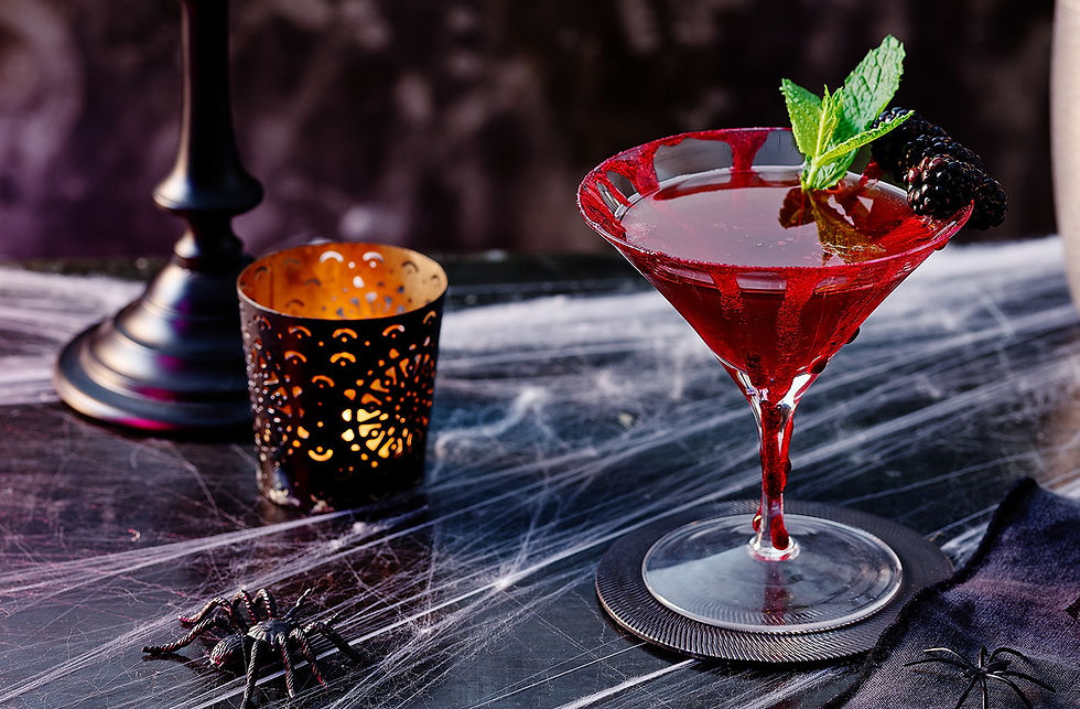 Sangria adorned by mint and a lit candle nearby.